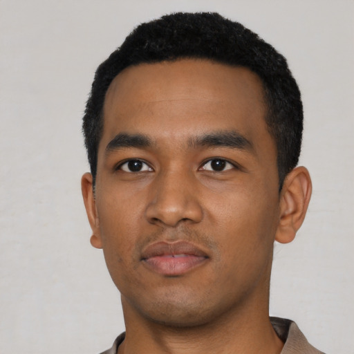 Neutral black young-adult male with short  black hair and brown eyes