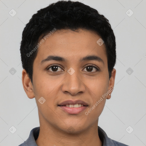 Joyful latino young-adult male with short  black hair and brown eyes