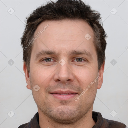 Joyful white adult male with short  brown hair and brown eyes