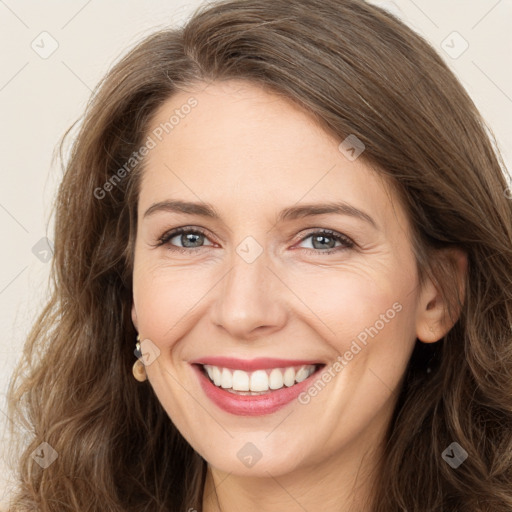 Joyful white adult female with long  brown hair and brown eyes