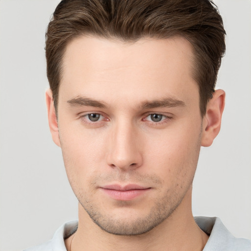 Neutral white young-adult male with short  brown hair and brown eyes