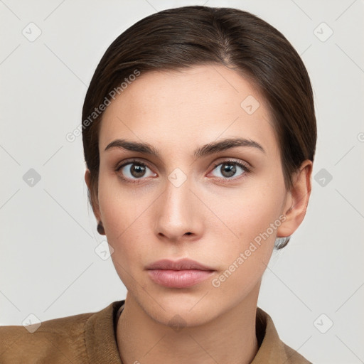 Neutral white young-adult female with short  brown hair and brown eyes