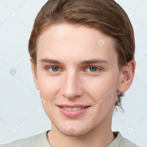 Joyful white young-adult female with short  brown hair and grey eyes