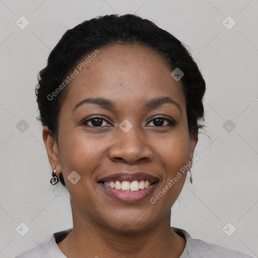 Joyful latino young-adult female with short  black hair and brown eyes