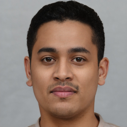Neutral latino young-adult male with short  black hair and brown eyes
