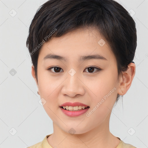 Joyful asian young-adult female with short  brown hair and brown eyes