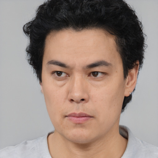 Neutral asian young-adult male with short  black hair and brown eyes