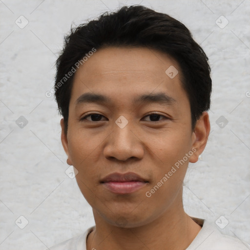 Joyful asian young-adult male with short  black hair and brown eyes