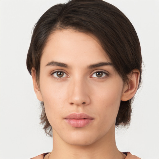 Neutral white young-adult female with medium  brown hair and brown eyes