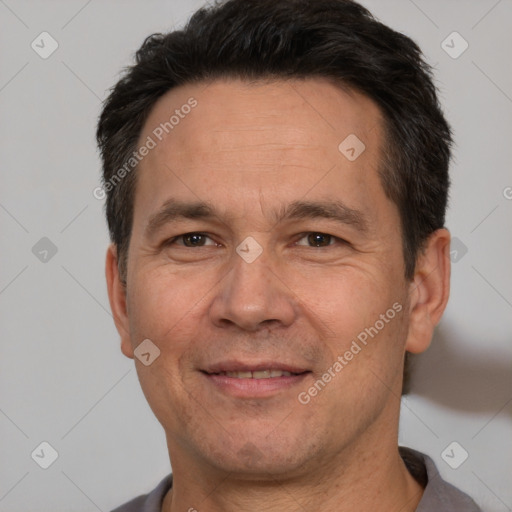 Joyful white adult male with short  brown hair and brown eyes