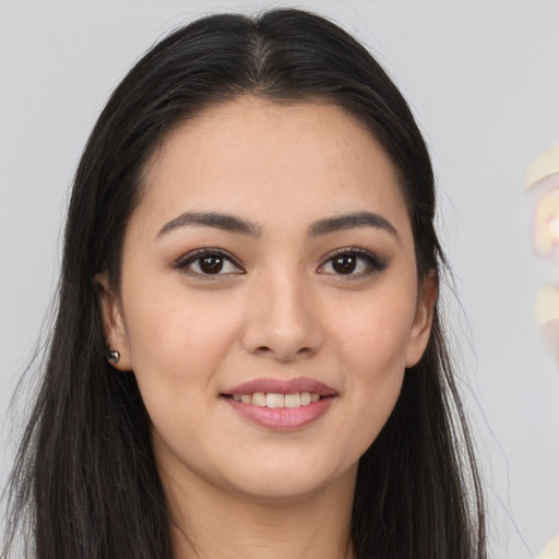 Joyful asian young-adult female with long  brown hair and brown eyes