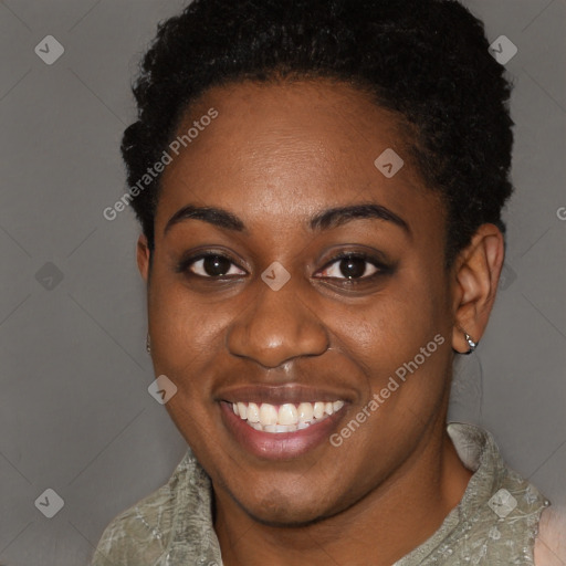 Joyful black young-adult female with short  brown hair and brown eyes