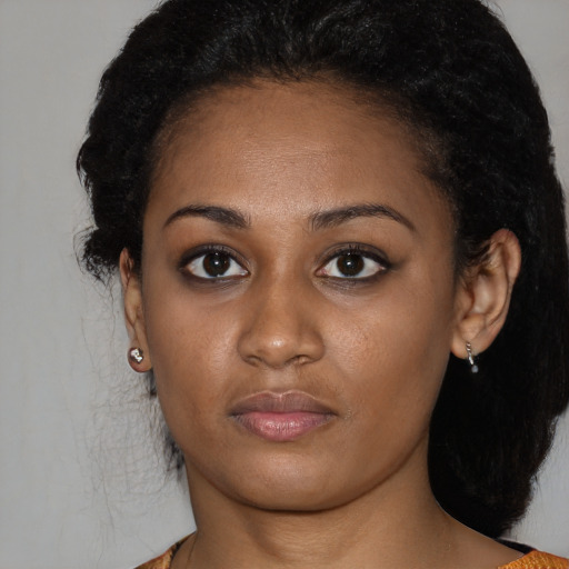 Neutral black young-adult female with medium  black hair and brown eyes