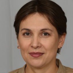 Joyful white adult female with short  brown hair and brown eyes