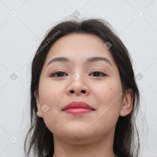 Joyful asian young-adult female with long  brown hair and brown eyes