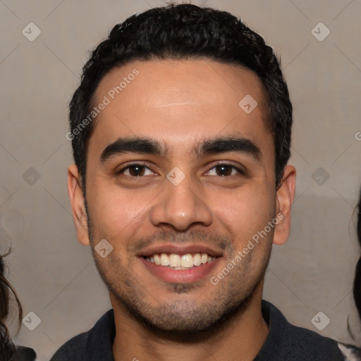Joyful white young-adult male with short  black hair and brown eyes