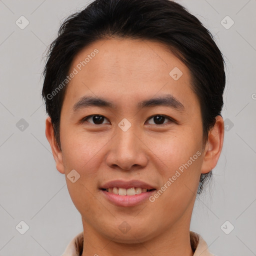 Joyful asian young-adult male with short  brown hair and brown eyes