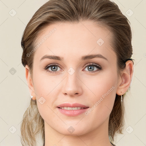 Joyful white young-adult female with medium  brown hair and blue eyes