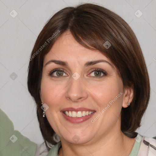 Joyful white young-adult female with medium  brown hair and green eyes