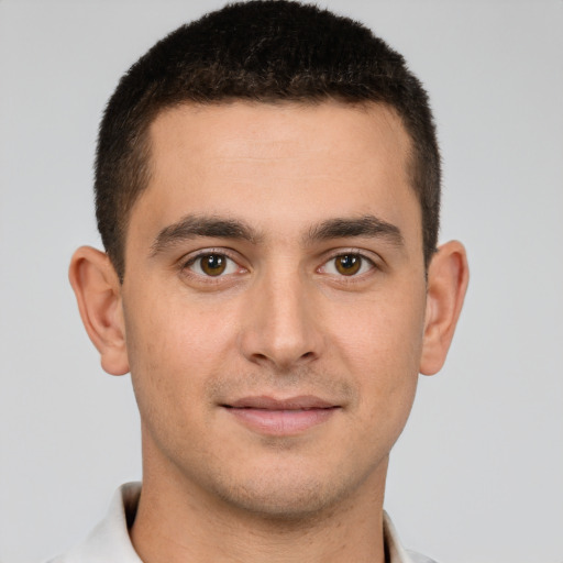 Joyful white young-adult male with short  brown hair and brown eyes