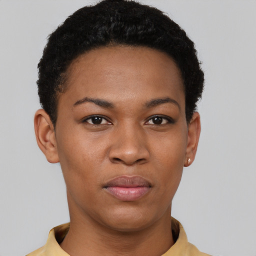 Joyful black young-adult female with short  black hair and brown eyes