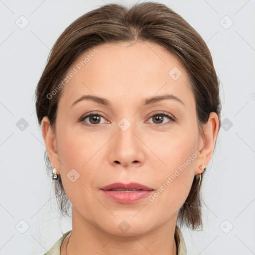 Joyful white adult female with medium  brown hair and grey eyes