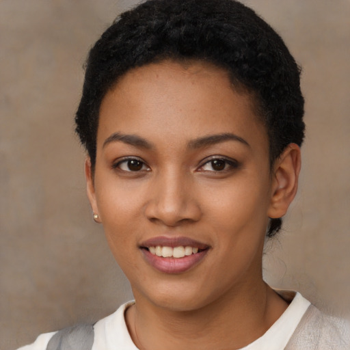 Joyful latino young-adult female with short  black hair and brown eyes