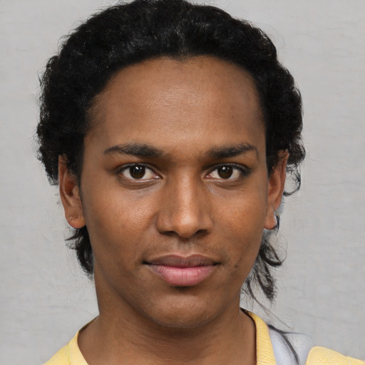 Neutral black young-adult male with short  black hair and brown eyes