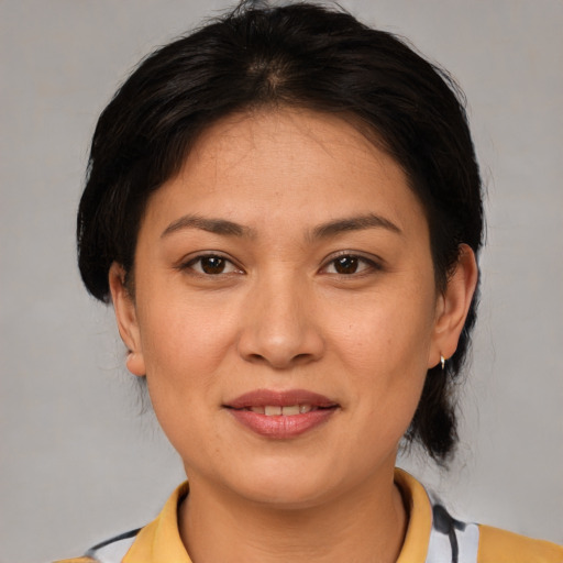Joyful white young-adult female with medium  brown hair and brown eyes