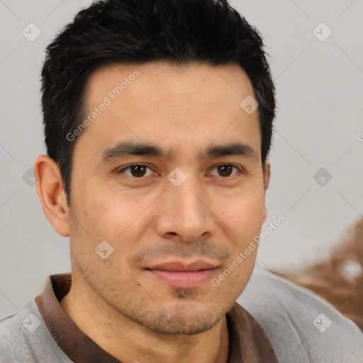 Joyful asian young-adult male with short  black hair and brown eyes