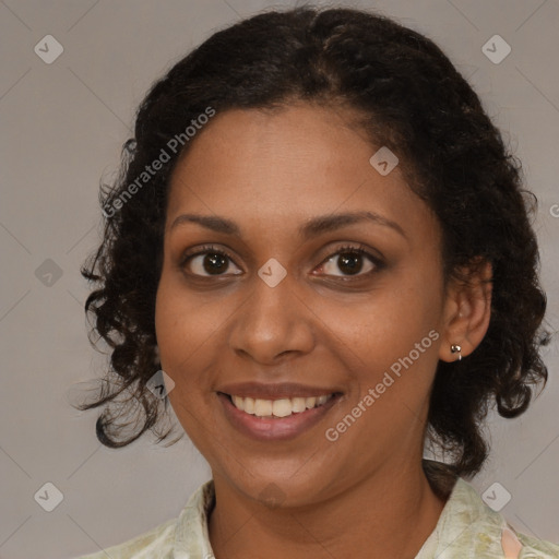 Joyful black young-adult female with medium  brown hair and brown eyes