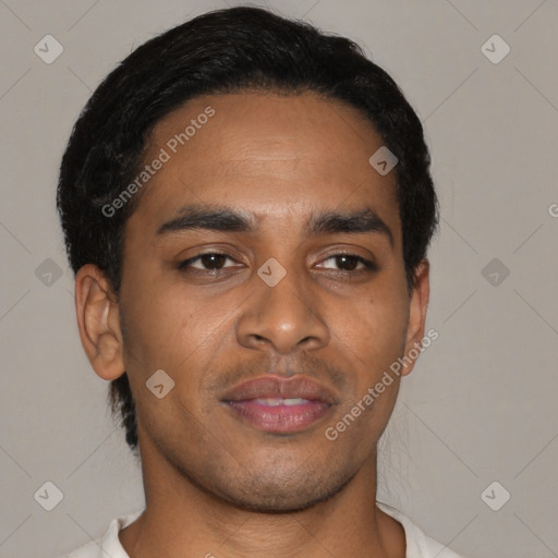 Joyful black young-adult male with short  black hair and brown eyes