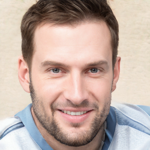 Joyful white young-adult male with short  brown hair and brown eyes