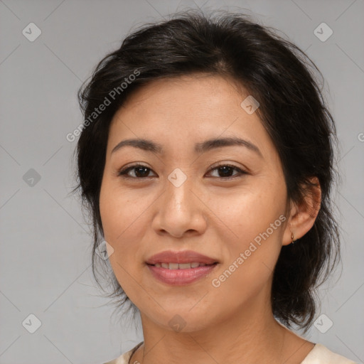 Joyful asian adult female with medium  brown hair and brown eyes