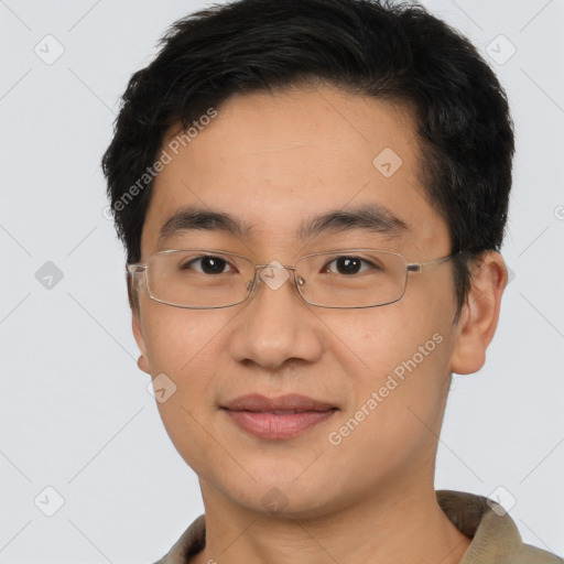 Joyful asian young-adult male with short  brown hair and brown eyes