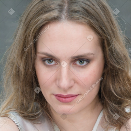 Joyful white young-adult female with long  brown hair and blue eyes