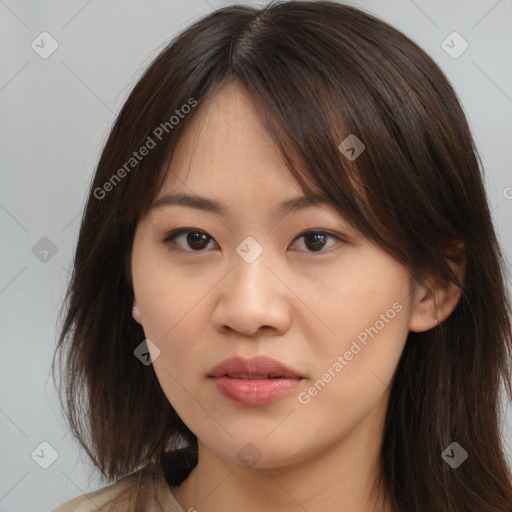 Neutral asian young-adult female with medium  brown hair and brown eyes