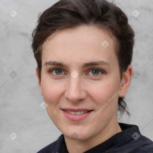 Joyful white young-adult female with short  brown hair and grey eyes