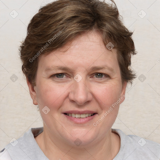 Joyful white adult female with short  brown hair and grey eyes