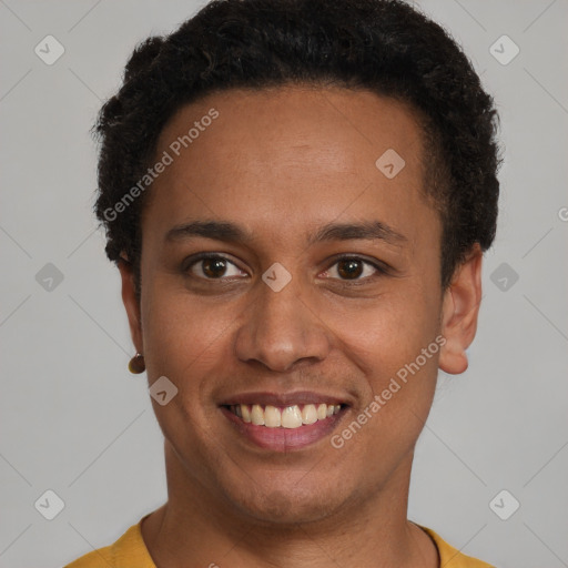 Joyful latino young-adult male with short  brown hair and brown eyes