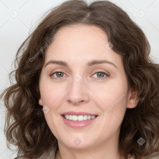 Joyful white young-adult female with medium  brown hair and green eyes