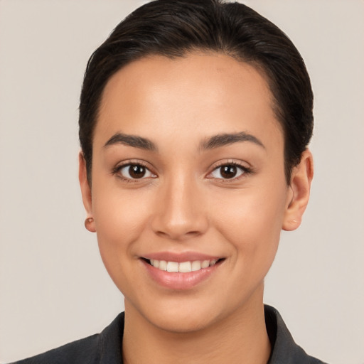 Joyful white young-adult female with short  brown hair and brown eyes