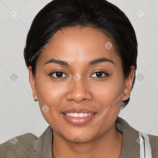 Joyful latino young-adult female with short  black hair and brown eyes