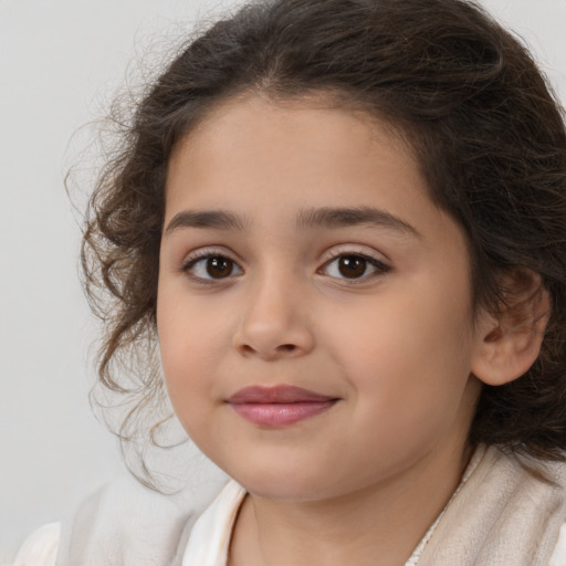 Joyful white child female with medium  brown hair and brown eyes