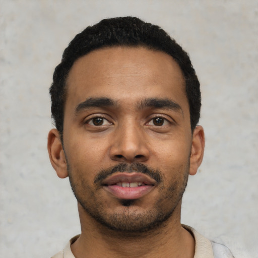 Neutral black young-adult male with short  black hair and brown eyes