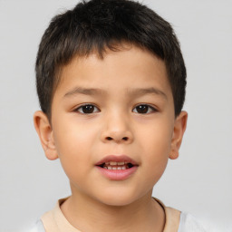 Joyful white child male with short  brown hair and brown eyes