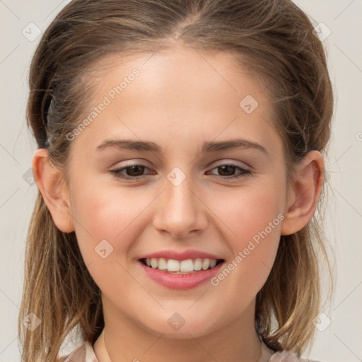 Joyful white child female with medium  brown hair and brown eyes