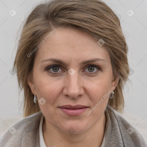 Joyful white adult female with medium  brown hair and grey eyes