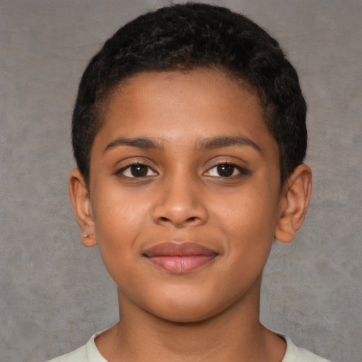 Joyful black child female with short  brown hair and brown eyes