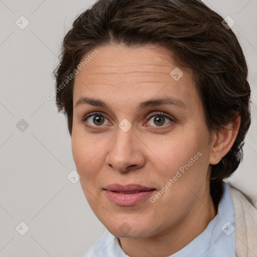 Joyful white adult female with short  brown hair and brown eyes